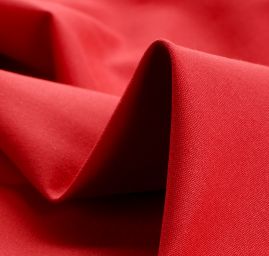 Bavlněná pevnější látka malinově červené barvy
